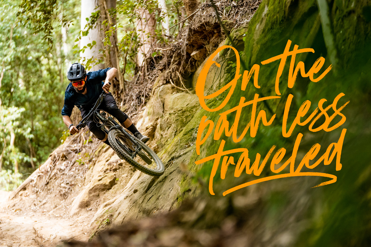 Post done by WOO Agency for Giant Bikes, showing a rider on a steep embankment of rocks on his Giant Bike